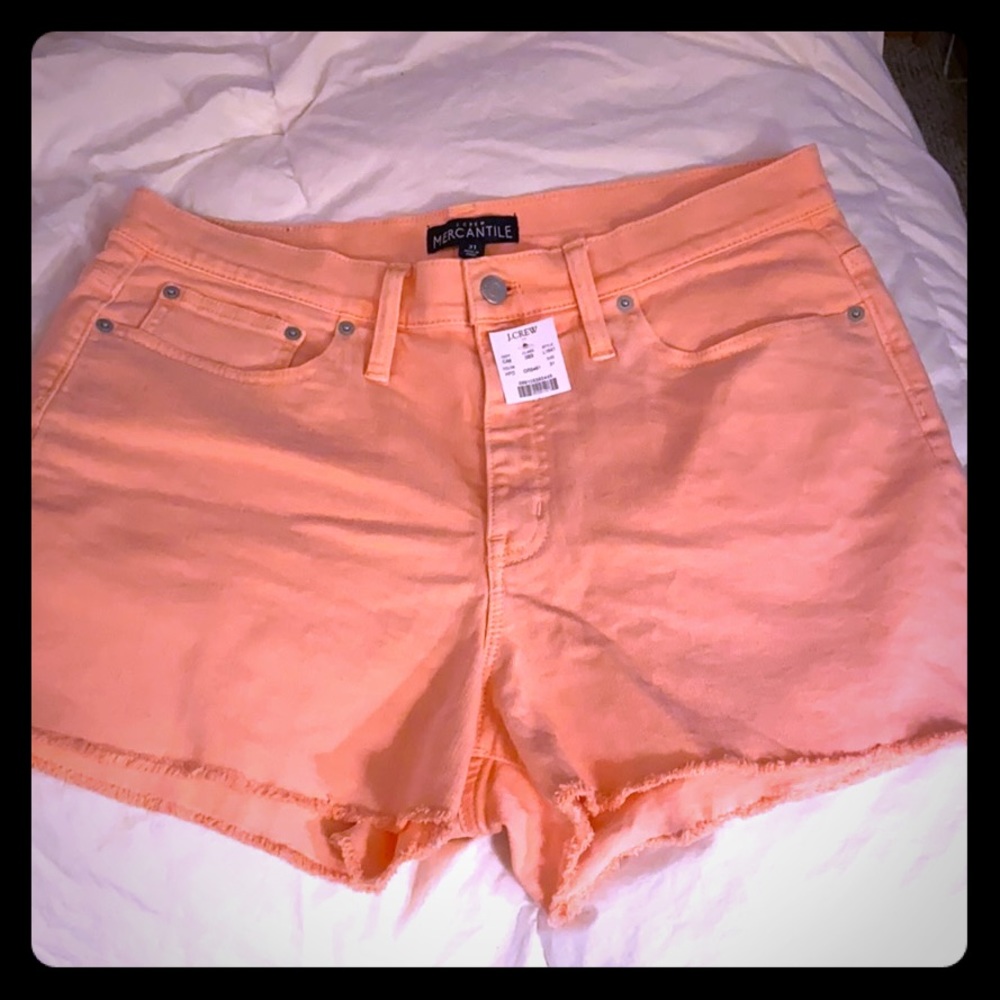 Sun washed sherbet orange cut off shorts